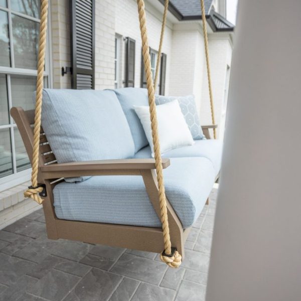 Classic Terrace loveseat swing in weatherwood. Cushions in Nude Beach Skt. Pillows in Canvas natural and Schooner sky
